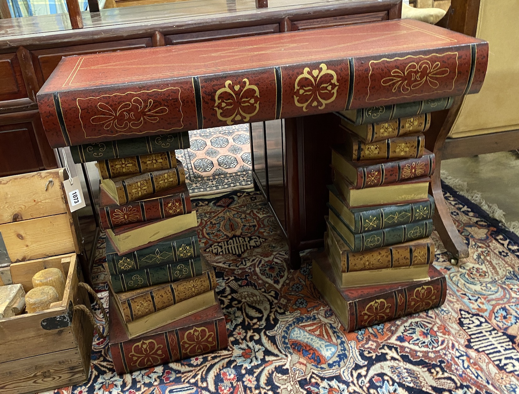 A contemporary painted console table modelled as a stack of books, width 91cm, depth 33cm, height 76cm